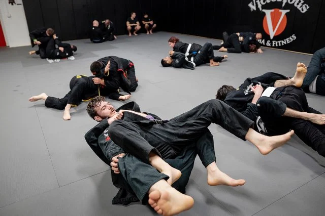 BJJ students rolling on the mats at Victorious MMA Troy Michigan