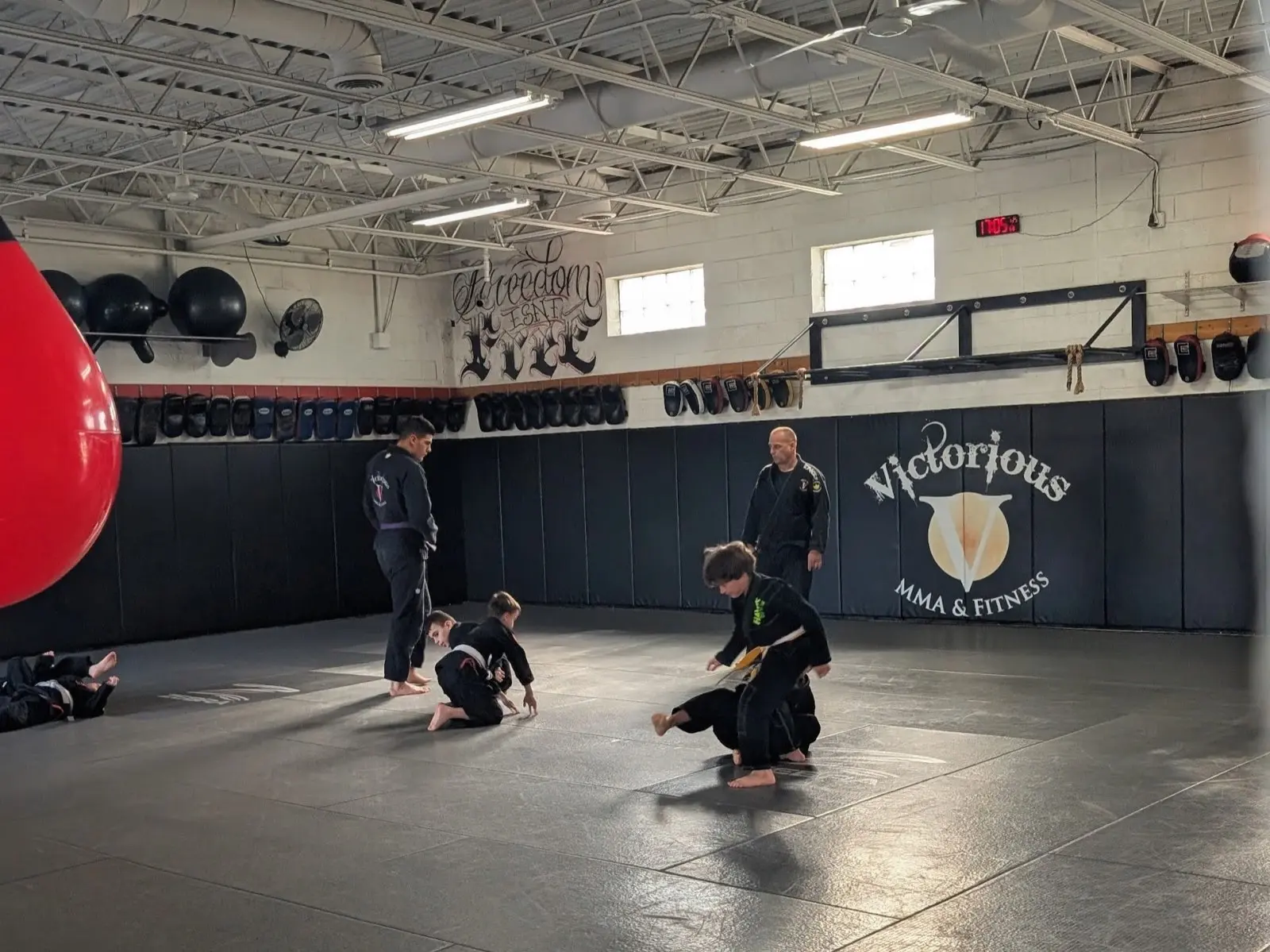 Kids BJJ class training on the mats at Victorious MMA Troy Michigan